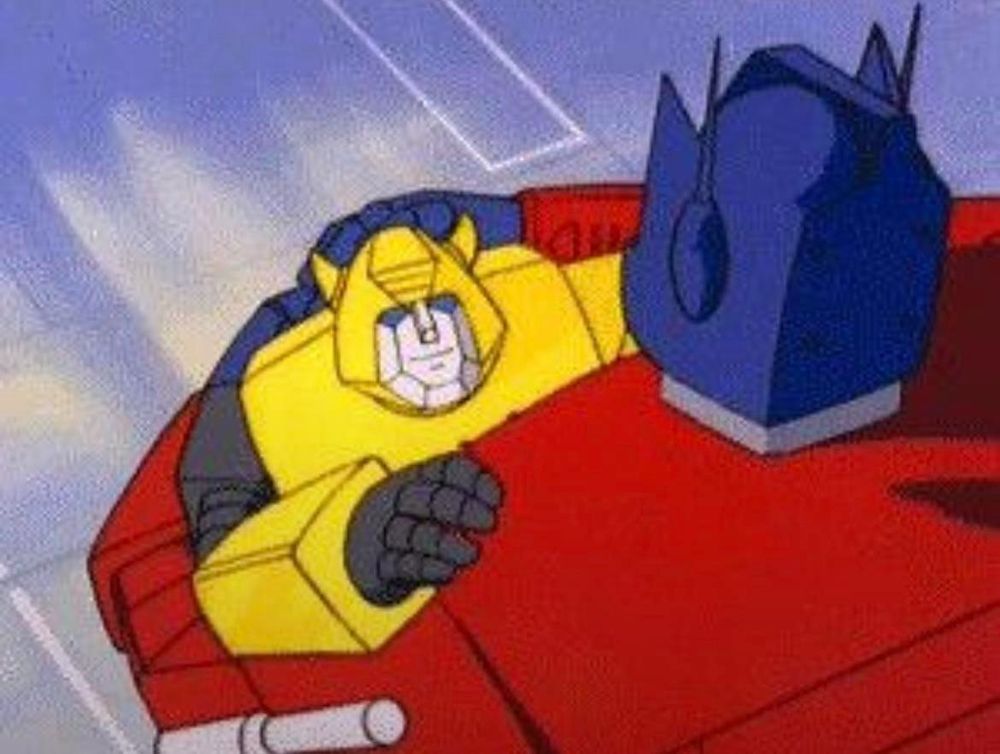 Optimus Prime hugging Bumblebee. Awwwww. Hope some of these tips have been at all helpful, and see you at TFNation, folks!