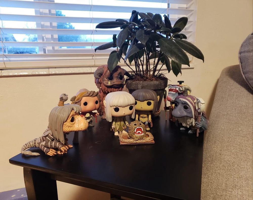 Nativity scene made with FunKo Pop figurines from “The Dark Crystal” (and Ludo from “Labyrinth”). Fizzgig is the baby Jesus. A rubber plant in the back gives it a palm tree in the desert feel. Nativity scene by Lia Hunter.