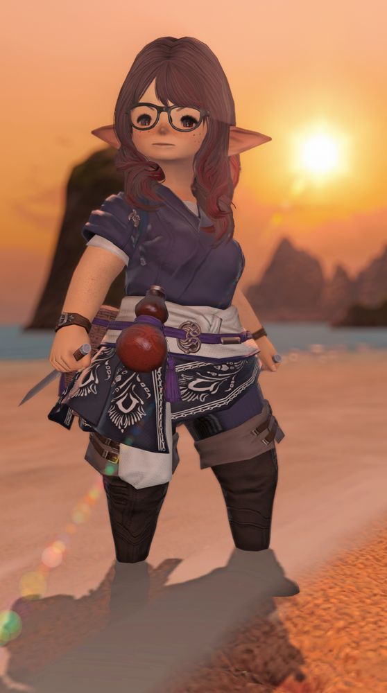 A lalafell, or halfling, from Final Fantasy 14. They are standing at the shoreline of a beach during sunset. They have long dark hair, fair skin, and glasses. They are wearing a short-sleeved japanese-style tunic with a drinking gourd on the hip. In their hands are a pair of small knives. They are looking off past the camera with a determined expression.