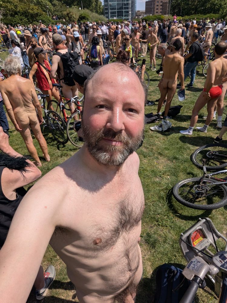 I am naked amongst a crowd of other naked people