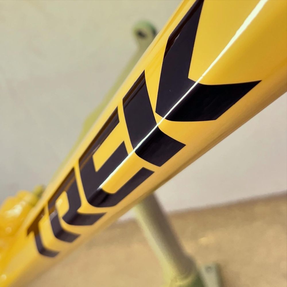 Closeup of Trek logo on freshly painted MTB frame. 