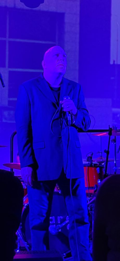 Jan Burnett on stage with Spare Snare at their performance at the V&A museum in Dundee on 8th July 2025.