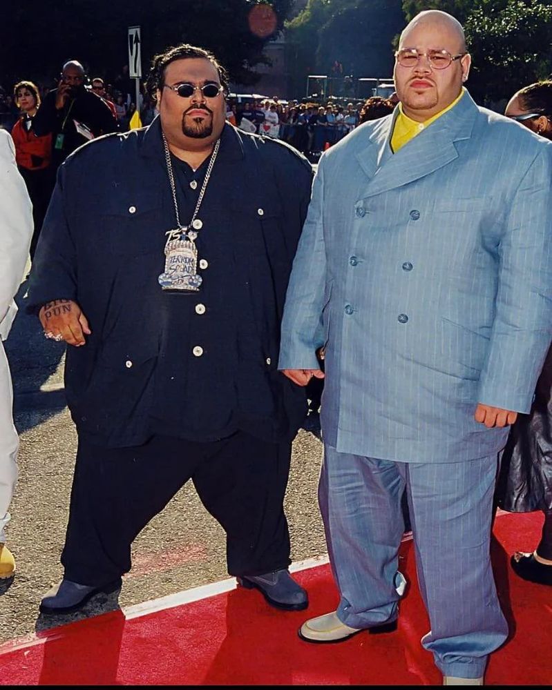 Big Pun and Fat Joe, circa 1999, in shiny tailored pinstripe suits