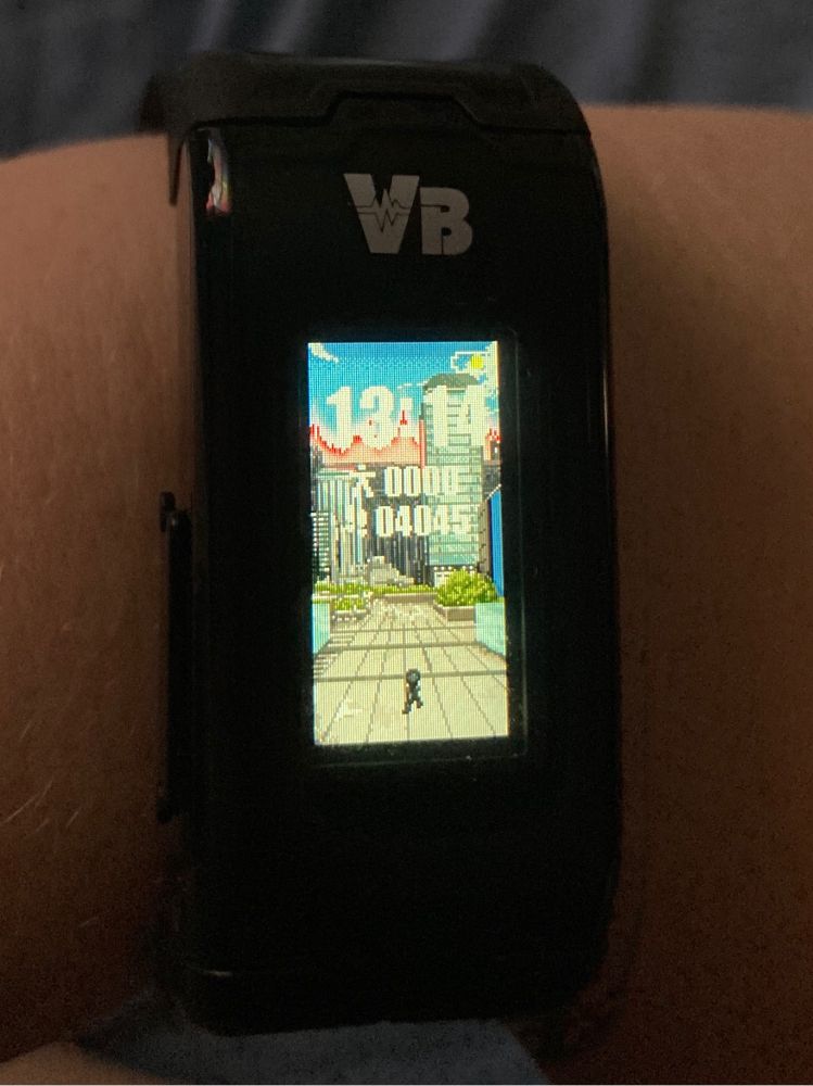 Vital bracelet with a small shadow on it. The background features the Skywall from KR Build.