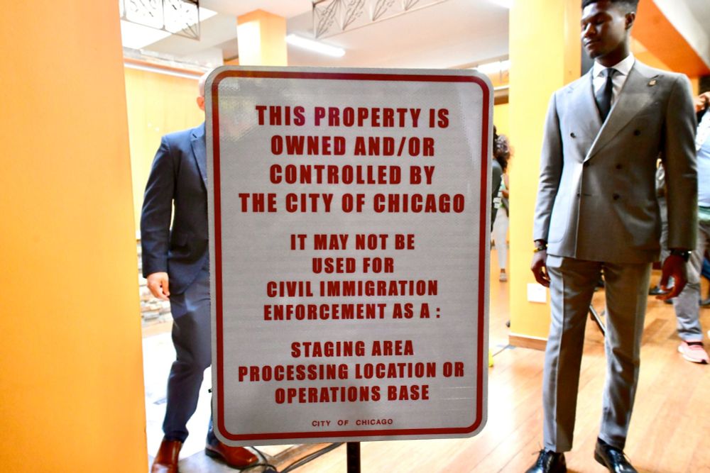 City of Chicago sign that says "This property is owned and/or controlled by the City of Chicago.  It may not be used for Civil Immigration Enforcement as a: Staging area, processing location or operations base."