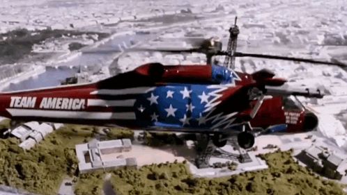 a red white and blue helicopter with the words team america on the side