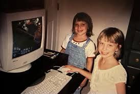 some girls in the computer room playing sims. my friends and i would have been alternating between committing diabolical acts in carefully designed homes and talking to strangers online. we’re drinking mountain dew and there are pizza rolls in the oven 