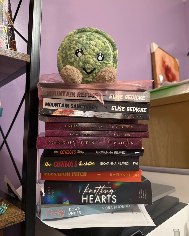 Pile of books on top of my printer.