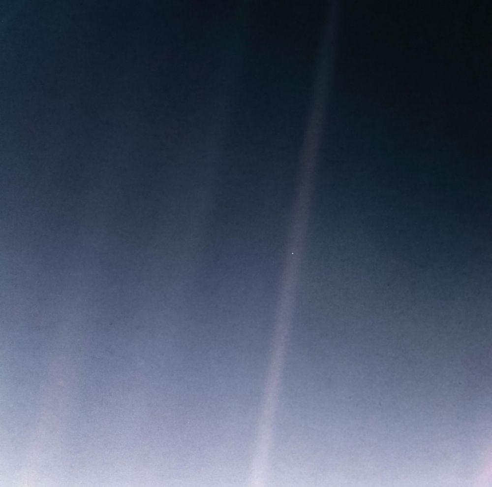 Look again at that dot. That's here. That's home. That's us. On it everyone you love, everyone you know, everyone you ever heard of, every human being who ever was, lived out their lives. The aggregate of our joy and suffering, thousands of confident religions, ideologies, and economic doctrines, every hunter and forager, every hero and coward, every creator and destroyer of civilization, every king and peasant, every young couple in love, every mother and father, hopeful child, inventor and explorer, every teacher of morals, every corrupt politician, every "superstar," every "supreme leader," every saint and sinner in the history of our species lived there--on a mote of dust suspended in a sunbeam.
The Earth is a very small stage in a vast cosmic arena. Think of the rivers of blood spilled by all those generals and emperors so that, in glory and triumph, they could become the momentary masters of a fraction of a dot. Think of the endless cruelties visited by the inhabitants of one corner of this pixel on the scarcely distinguishable inhabitants of some other corner, how frequent their misunderstandings, how eager they are to kill one another, how fervent their hatreds.
Our posturings, our imagined self-importance, the delusion that we have some privileged position in the Universe, are challenged by this point of pale light. Our planet is a lonely speck in the great enveloping cosmic dark. In our obscurity, in all this vastness, there is no hint that help will come from elsewhere to save us from ourselves.
The Earth is the only world known so far to harbor life. There is nowhere else, at least in the near future, to which our species could migrate. Visit, yes. Settle, not yet. Like it or not, for the moment the Earth is where we make our stand.
…To me, it underscores our responsibility to deal more kindly with one another, and to preserve and cherish the pale blue dot, the only home we've ever known.

— Carl Sagan, Pale Blue Dot, 1994