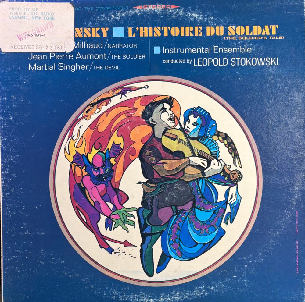 Stravinsky Histoire du Soldat [A Soldier’s Tale] ensemble info in alt text of next picture, album art depicts the soldier playing his violin attended by his gf, while the devil sneaks up behind him