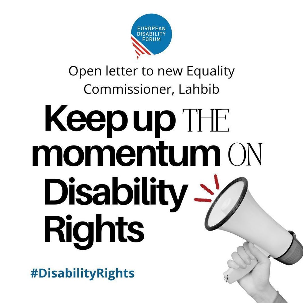 Hand witha  microphone pointing to sign saying "Keep up the momentum on disability rights!"