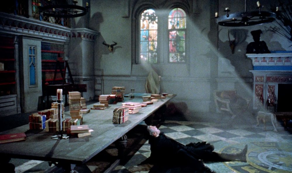 Count Dracula (Christopher Lee) throws himself to the floor to avoid bright sun rays streaming through a stained glassed window. Dracula - 1958 - Hammer Films.