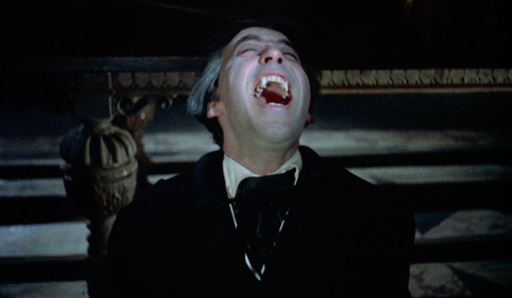 Count Dracula (Christopher Lee) grimaces at the sunlight, bearing his fangs. Dracula - 1958 - Hammer Films.
