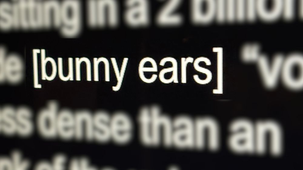 Blurry teleprompter screenshot with the stage direction [bunny ears] clear and the rest is not relevant to the post. 