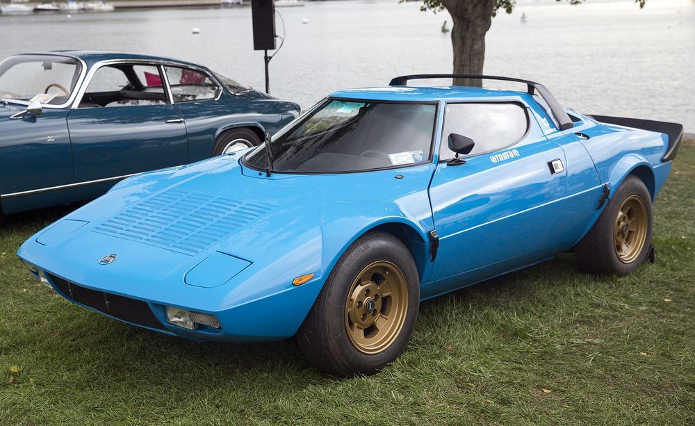 Blue 1974 Lancia Stratos Stradale rally car. This is a small, two-door rally car with a single front windshield wiper.