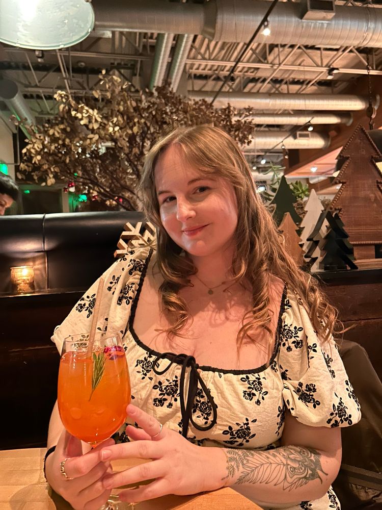 Brinley sitting at a table 