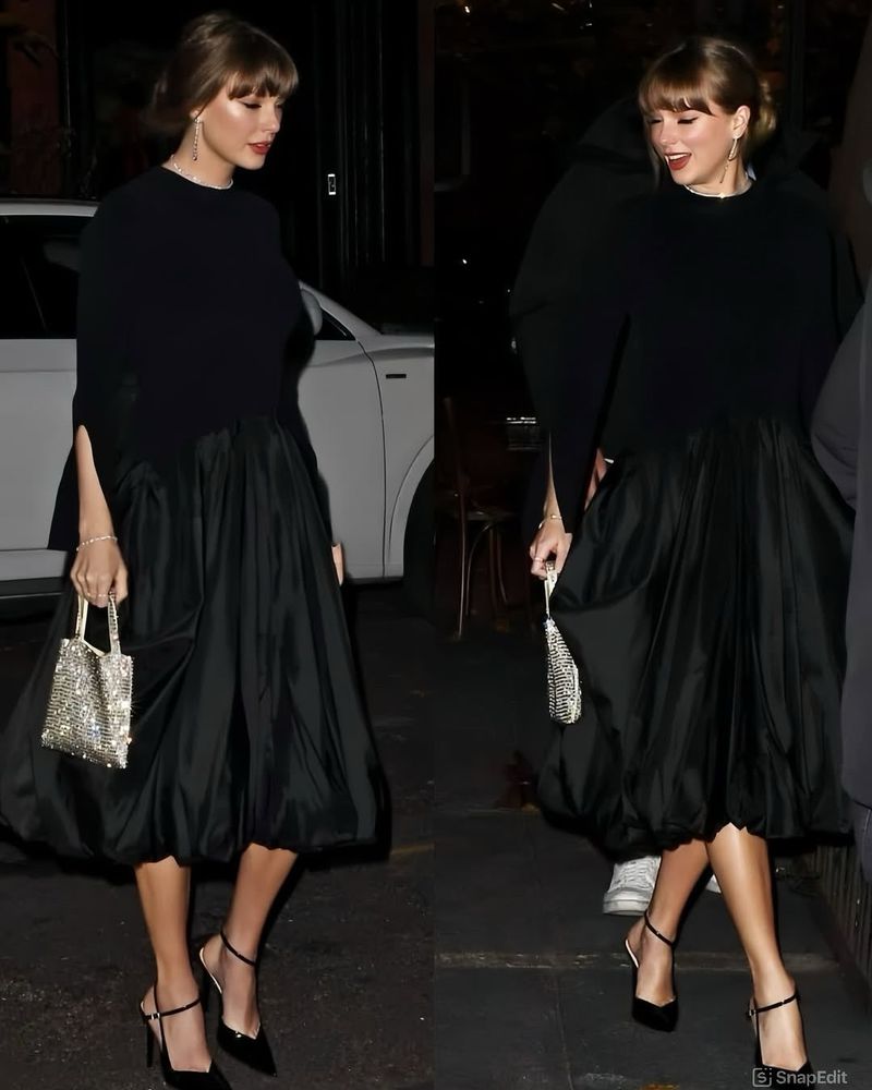 Taylor Swift wearing a black dress 