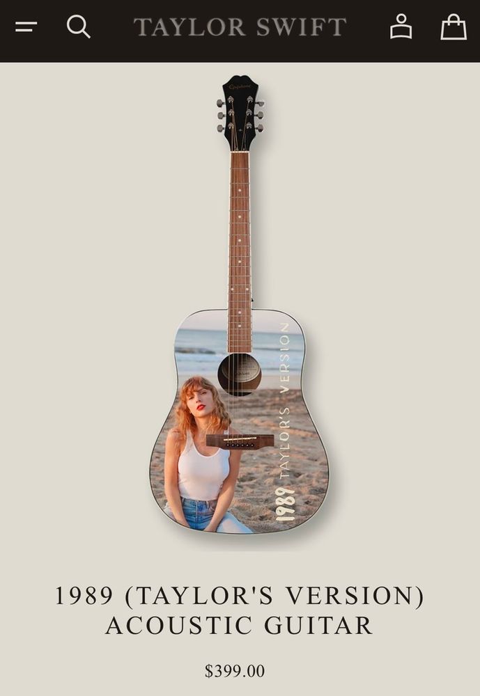A screenshot from Taylor Swift's website of the 1989 (Taylor's version) acoustic guitar. The guitar features a picture of Taylor on the beach kneeling with "1989 Taylor's Version parallel to the neck on the body of the guitar. 