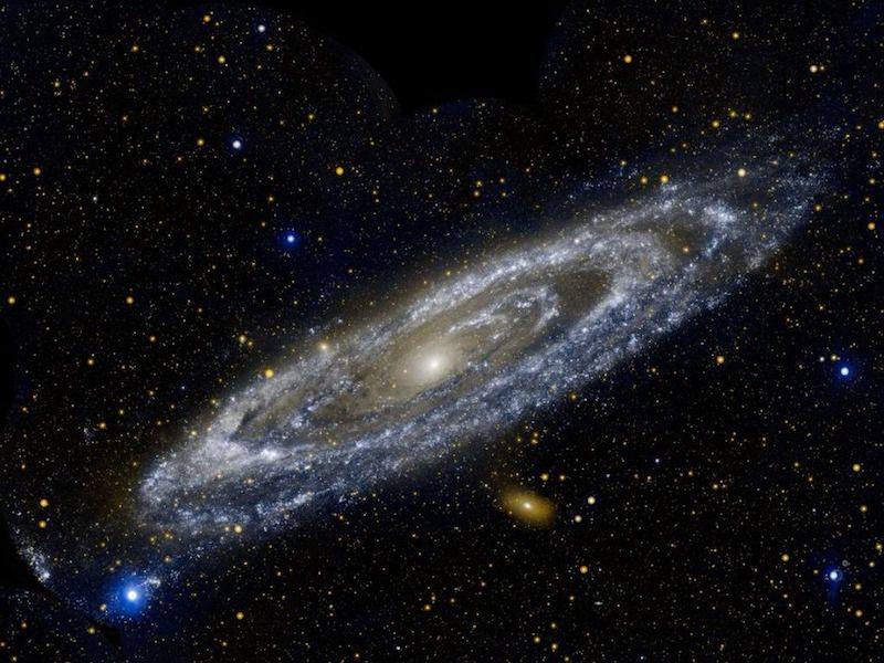 The Andromeda Galaxy which is at a 45 degree angle, marked by blue and yellow spirals. From NASA.