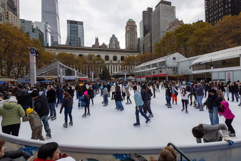 Ice skaters at the Holiday Village ice rink in Bryant Park, Manhattan, New York City on the day after Thanksgiving