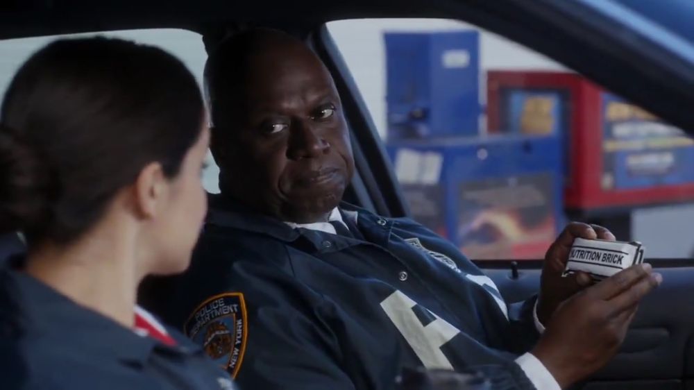 Scene from Brooklyn 99 where captain Holt is telling Amy about his Nutrition Bricks when she suggests they get street meat from a food stand during a stakeout  