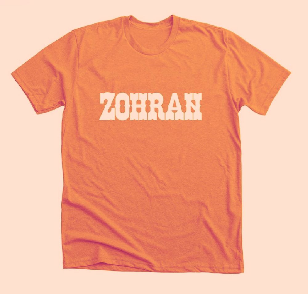 An orange tshirt with “Zohran” in the Zabars font 