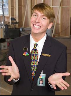 Jack McBrayer as Kenneth the page on 30 rock in page jacket and NBC tie. 