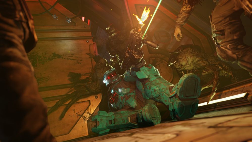 A Spartan, a character in futuristic armor from the Halo universe, is on the ground armed with a shotgun and defends himself as best he can against a horde of zombies (the Flood)