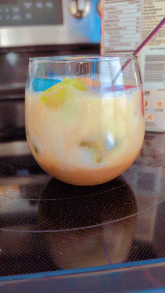 my iced coffee after i poured the milk, showing how cool it looks 