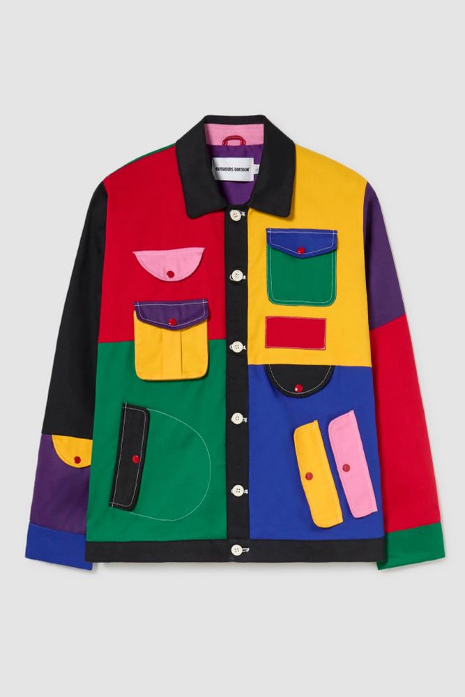 A jacket the front of which is split into quadrants, the left side red above green, the right side yellow above blue. The left sleeve runs black to purple to blue, while the right sleeve runs from purple to red to green. The pockets clash throughout: pink on red, black on green, blue and red on yellow, pink ands yellow on green. From what can be seen of the lining, it's purple with a pink collar.
