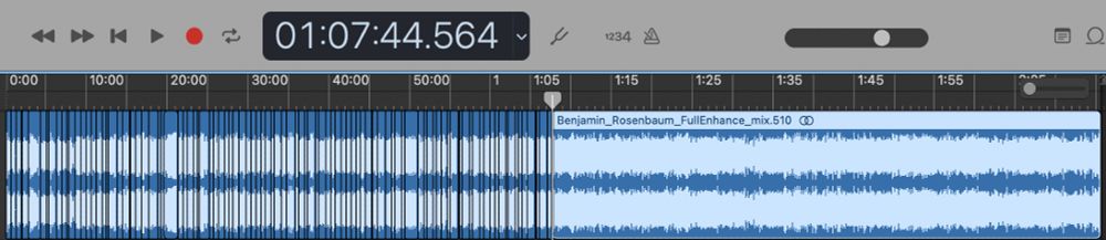 The sound waves of our voices in GarageBand, the left half showing many snips and the right untouched. A time stamp shows the cursor halfway at 01:07:44.564.