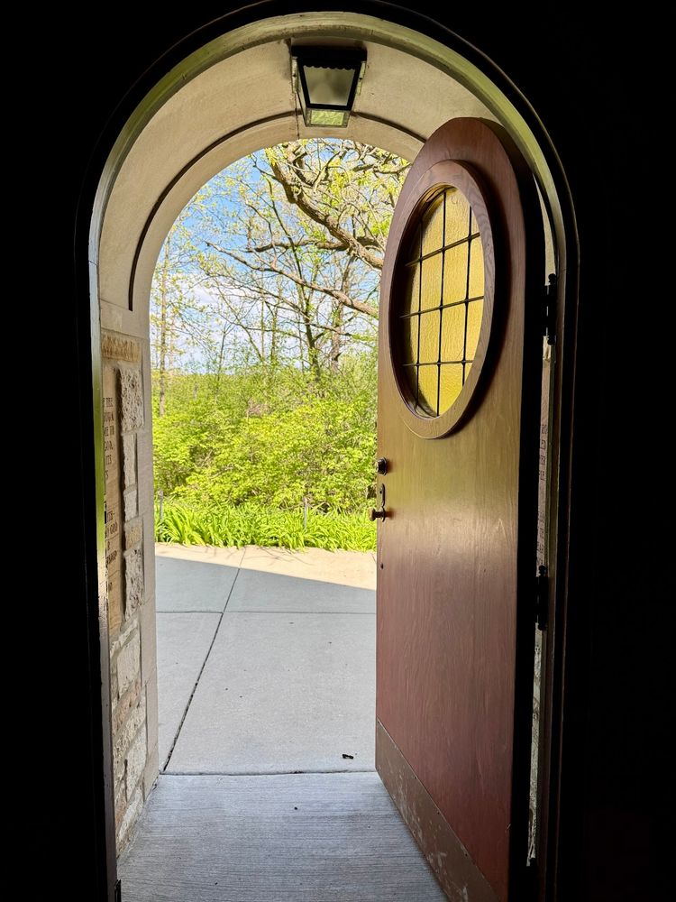 Looking out of the chapel at The Center of Palos Park into the woods