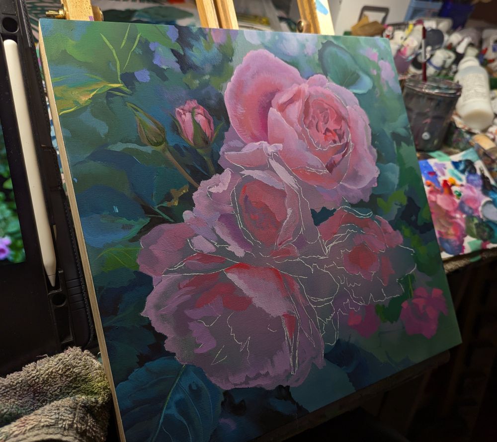 Painting of pink roses on easel