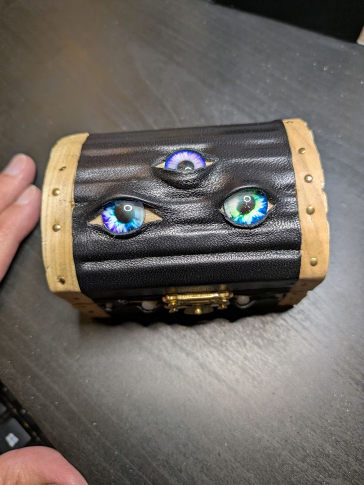 The top of the teeny tiny box, showing three cute eyes. Leather has been applied