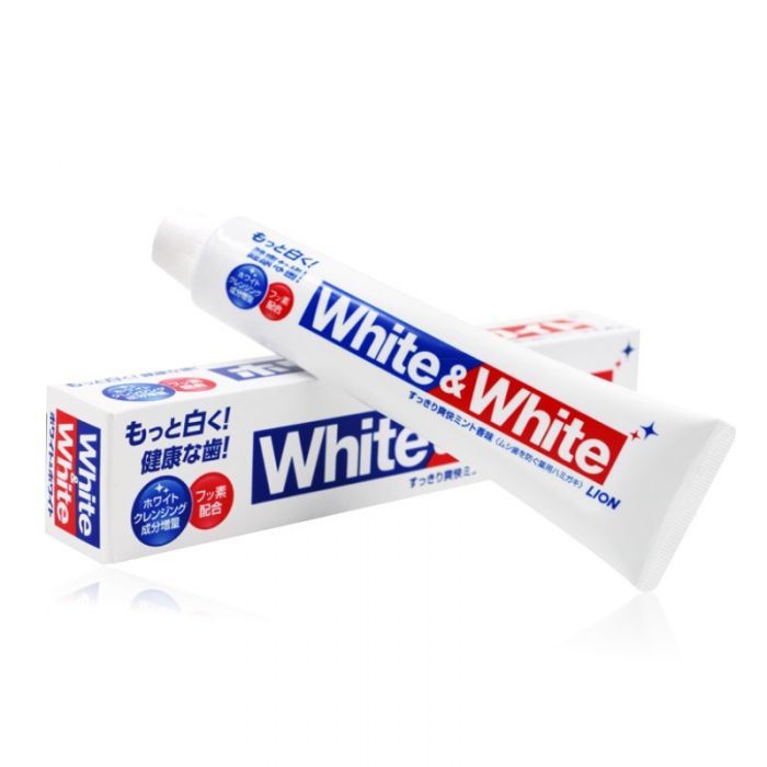 a white tube of toothpaste with a blue and red marquee with "White & White" in white in a san serif font. On the left in Japanese in a blue sans serif font it's says in Japanese "Even whiter! Something... something Teeth!" The tube rests on a box that is largely identical.