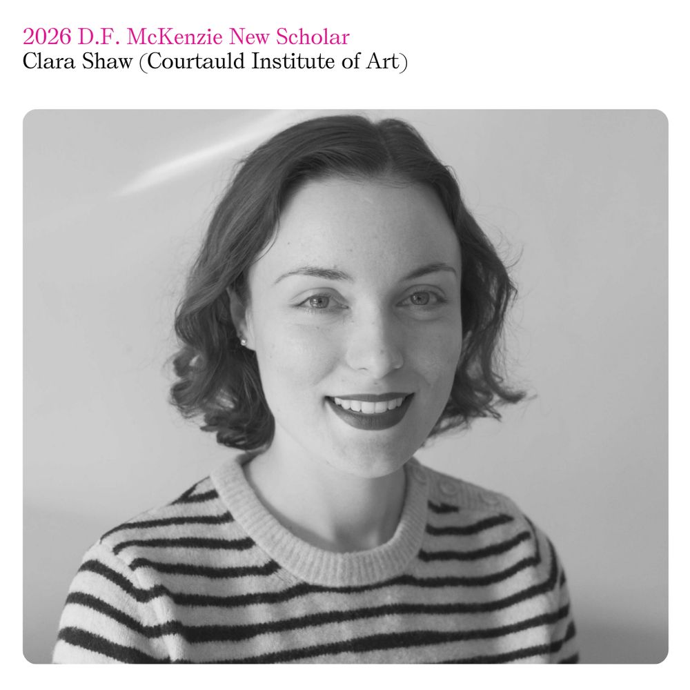 Black and white photo of Clara Shaw, smiling and wearing a horizontally striped shirt