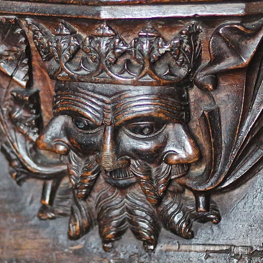 Green Man misericord carved in 1440 at Cartmel Priory, Cumbria.