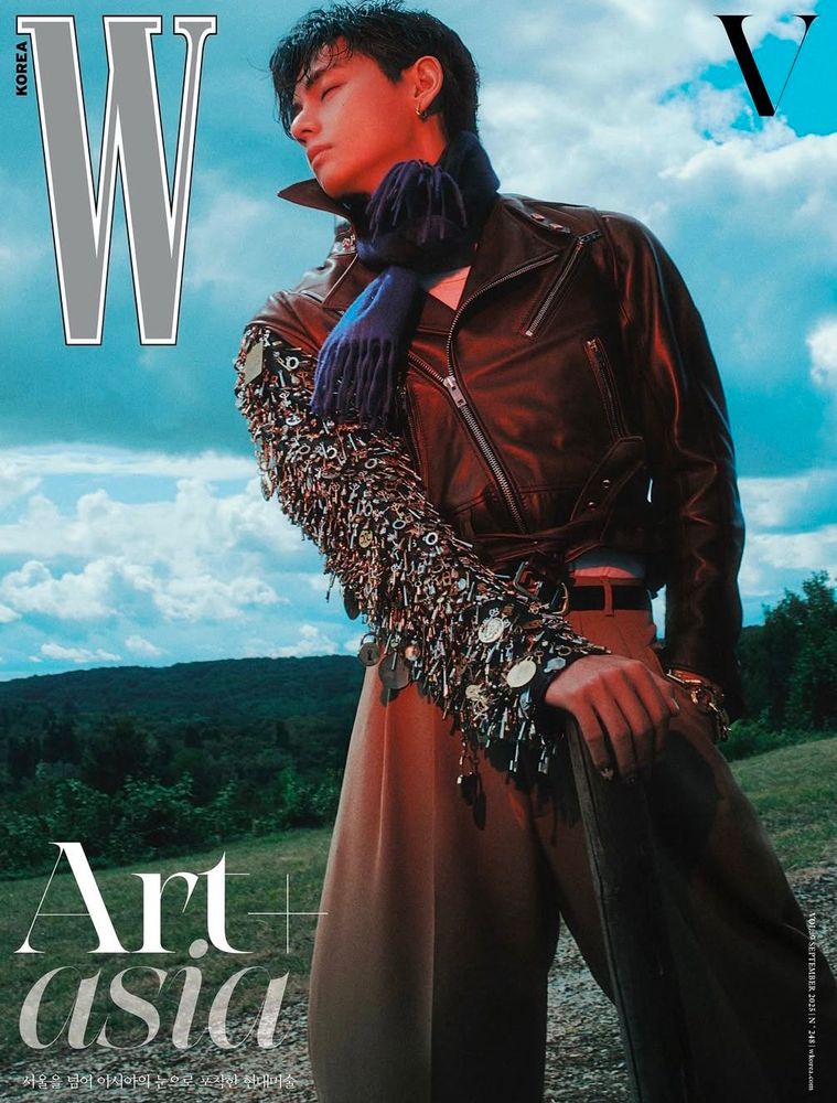 Taehyung for W Korea

Taehyung is wearing brown trousers, and a cropped zippered jacket with the right sleeve looking like the Winter Soldier’s metal arm, and he also has a blue scarf around his neck
