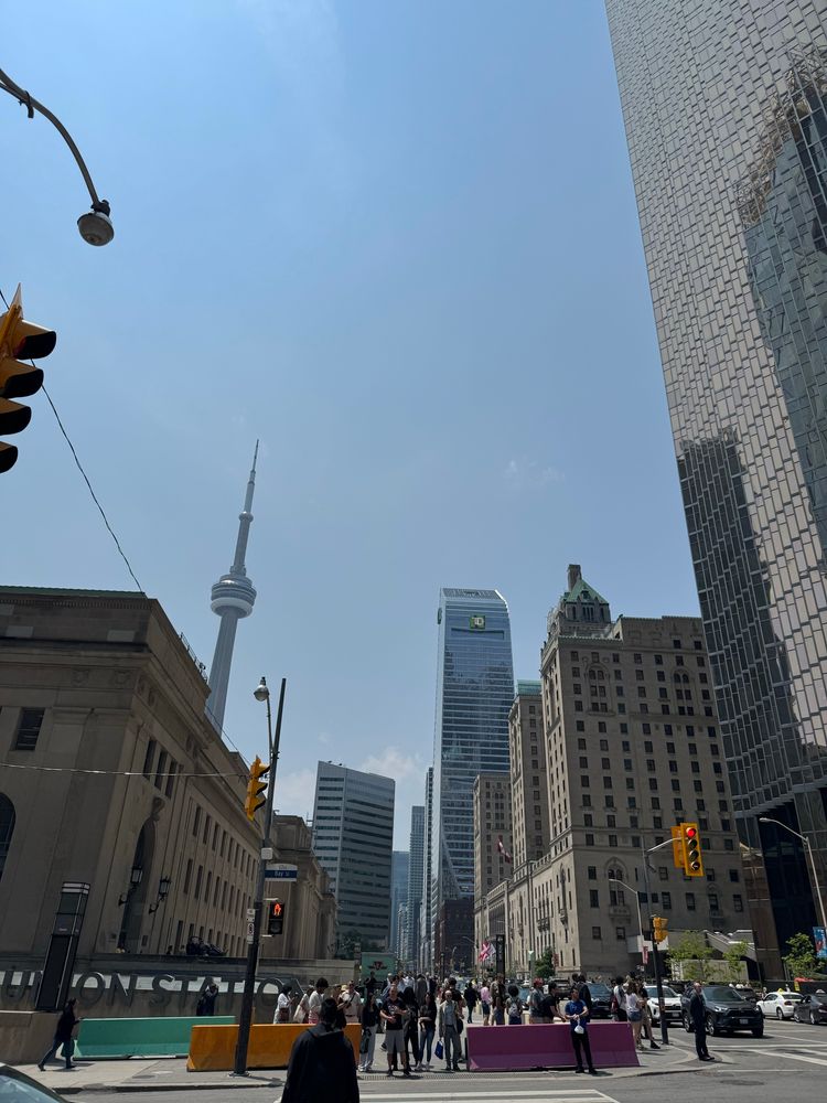 Photo of union station in Toronto, with the CN tower and a few other skyscrapers in the background.