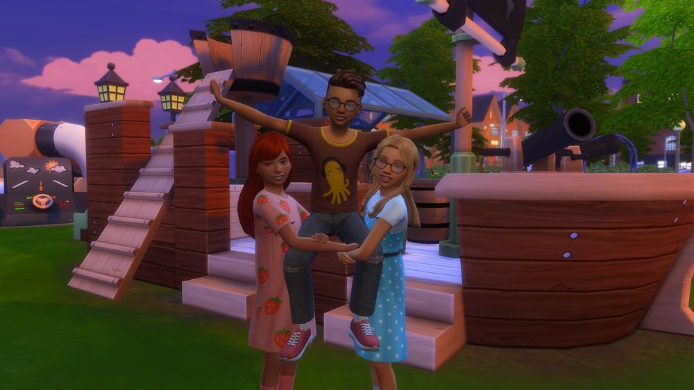 Tori and Alys posing by picking Artie up