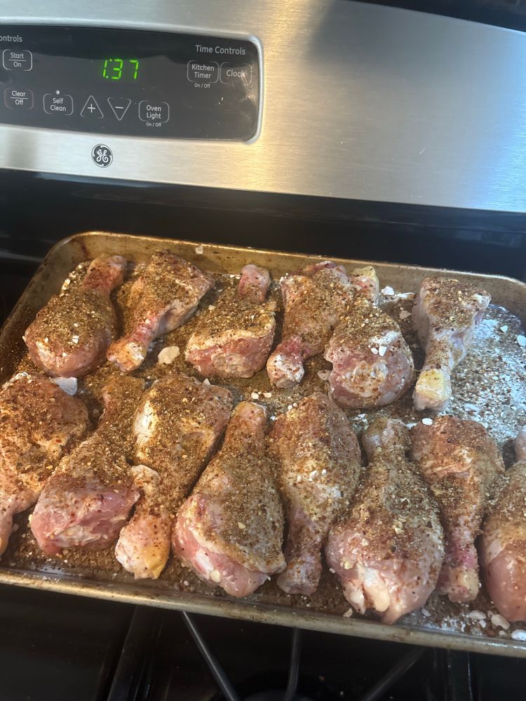 A dozen chicken legs seasoned and ready for smoking