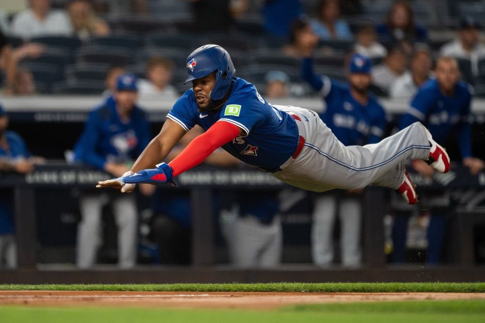 Vladimir Guerrero Jr. sliding into home plate 