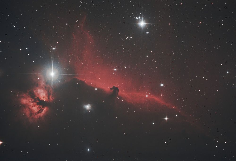 Picture of the Horsehead- and Flame Nebula in Orion. Shot with a 130/650mm Newton telescope and a Canon EOS 700d DSLR. 2 minute exposures and total integration time of ~2.5 hours.