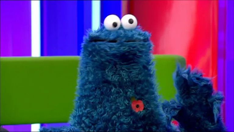 Cookie Monster on The One Show wearing his poppy 