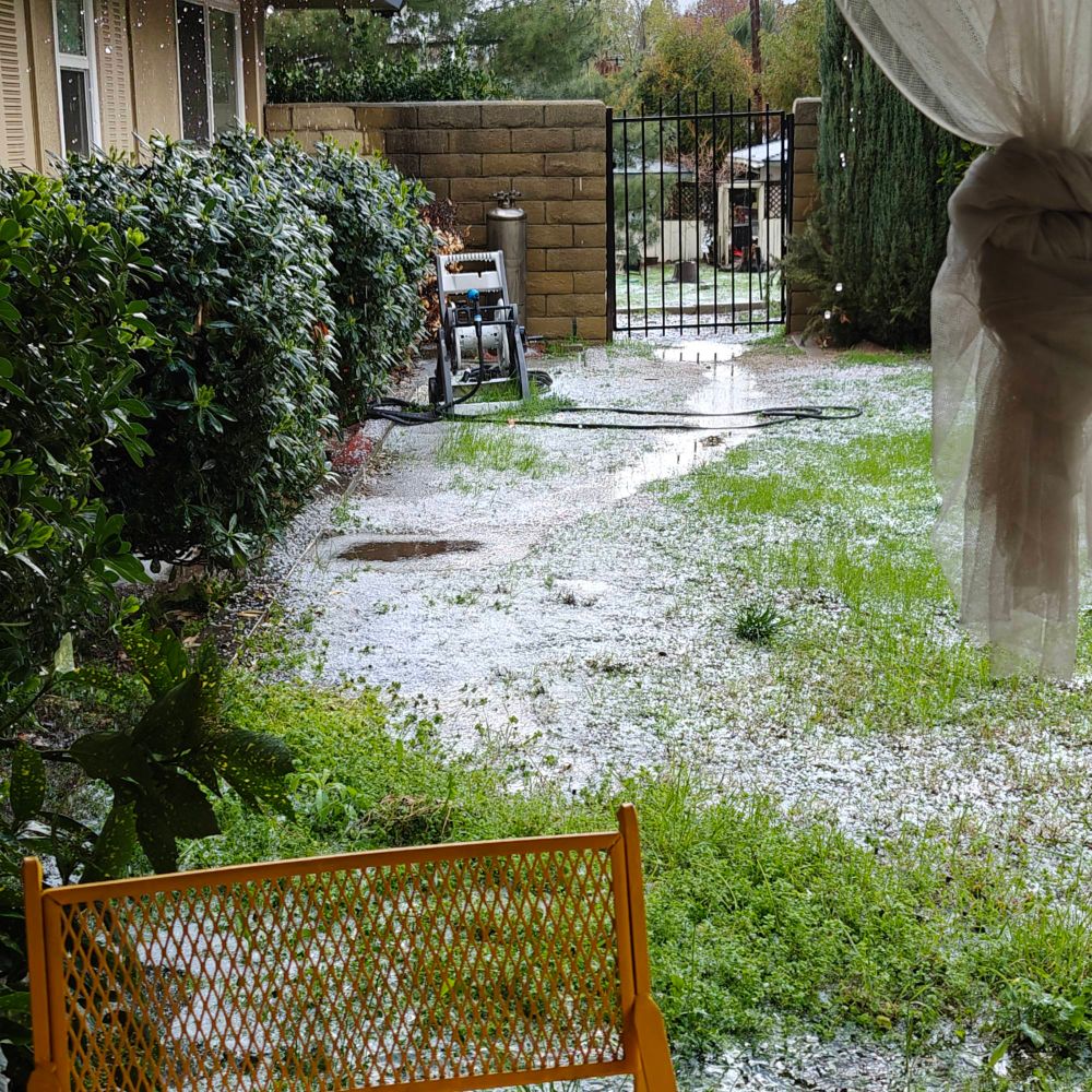 Hail and deep puddles on grass