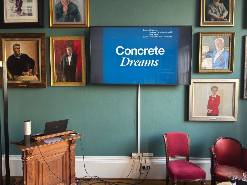 TV Screen showing the cover of Concrete Dreams book.