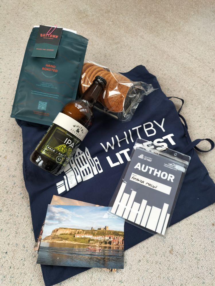 WhitbyLitfest tote bag, coffee, beer, ginger biscuits and my lanyard 