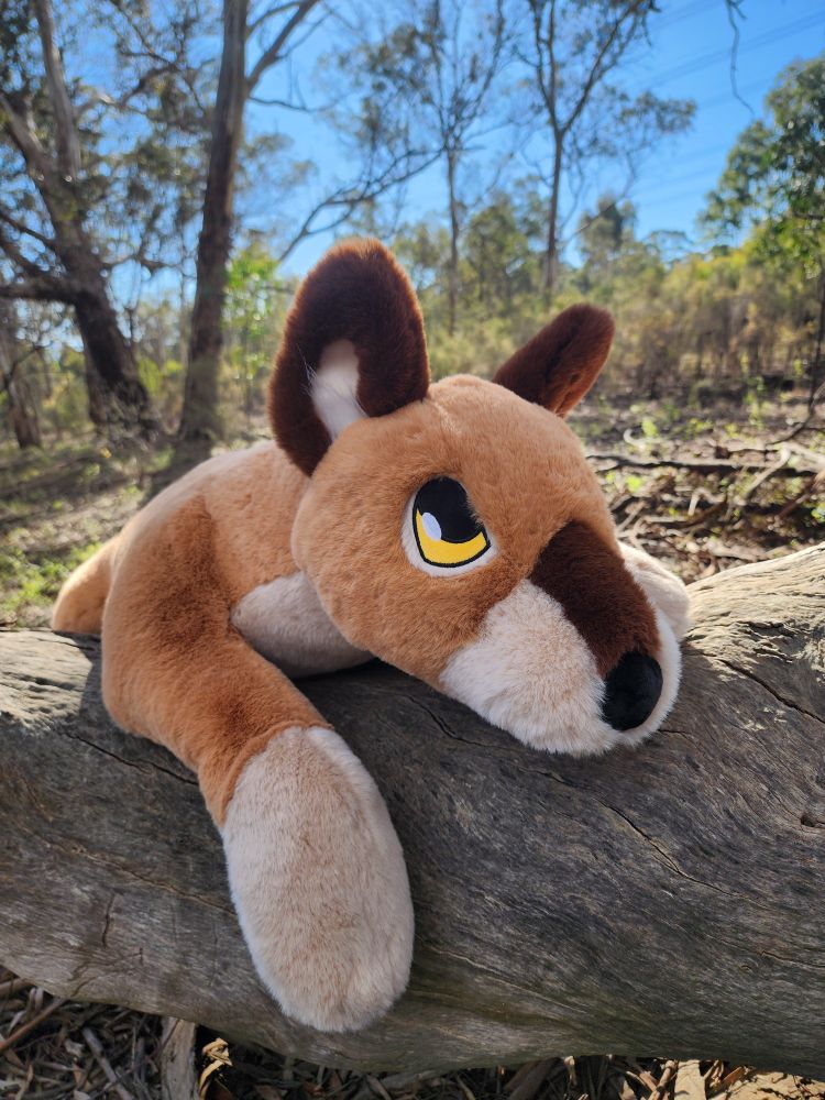 Thylacine plush on a log