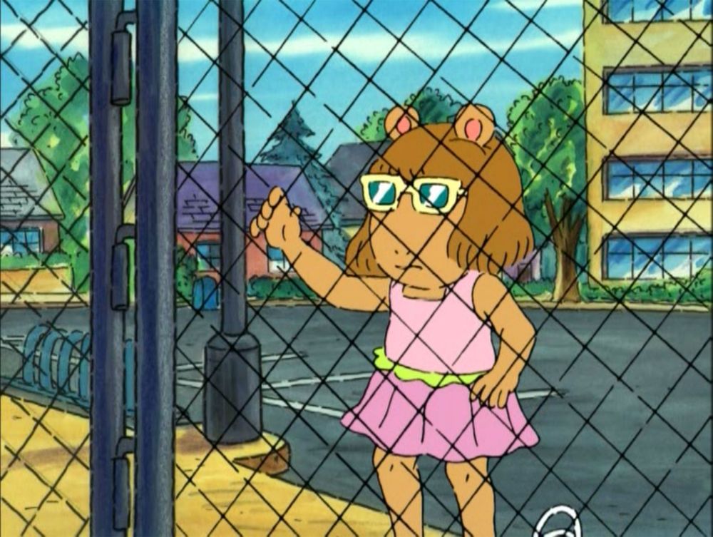 DW from Arthur looking from behind a chain link fence meme