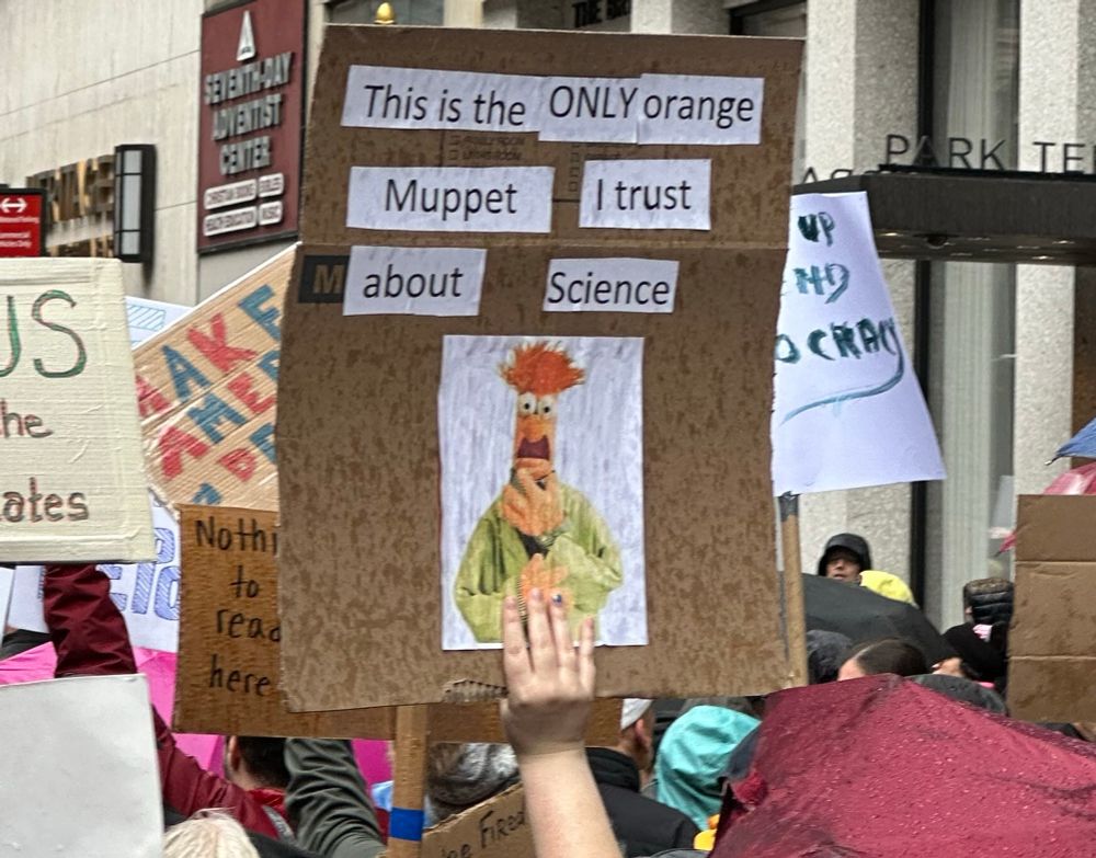 Sign at nyc protest: this is the only orange muppet I trust about science 